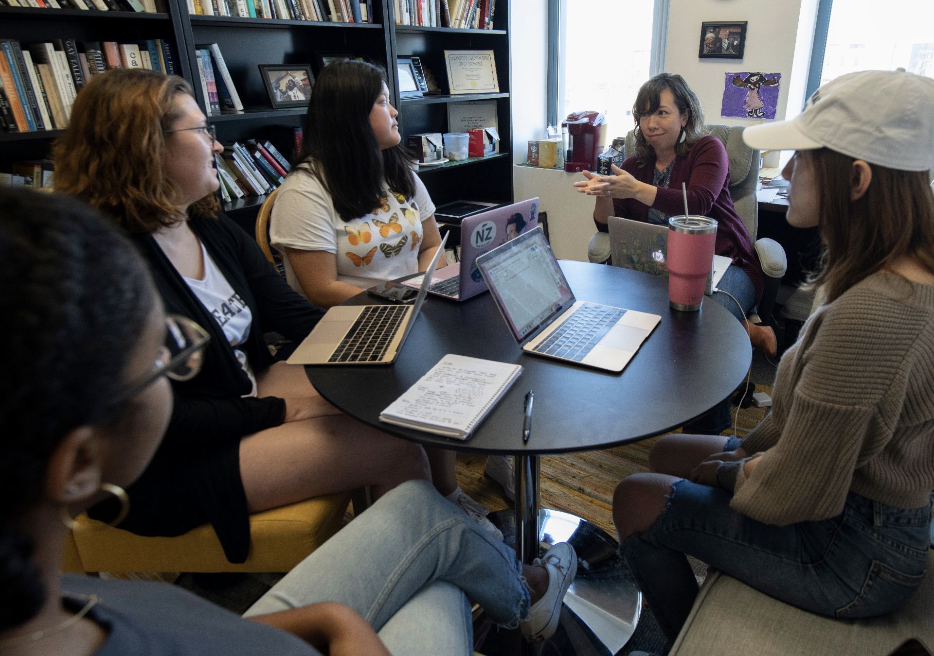 Literary journalism associate professor Erika Hayasaki works with students in her office